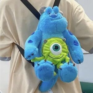 Blue and Green Monster Plush Backpack. New without tags